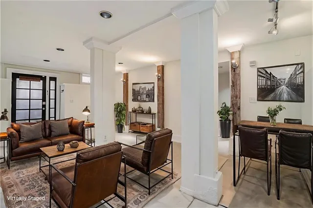 a view of kitchen with furniture and refrigerator