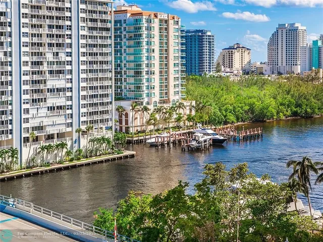 a view of a lake with tall buildings