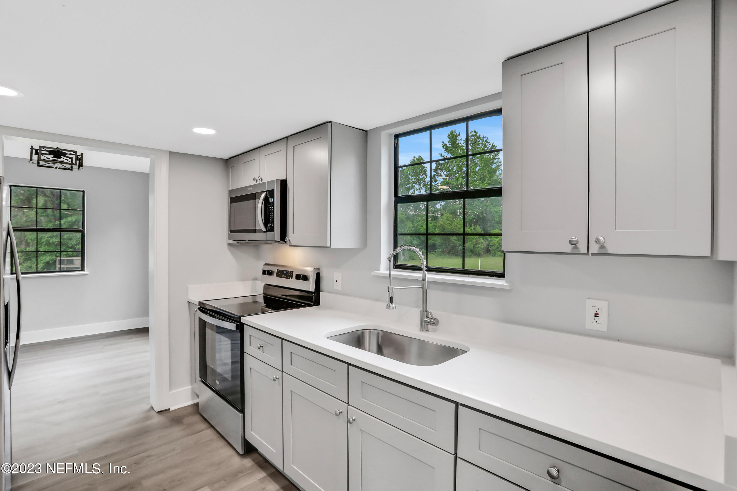 45195 Browns Farm Road Callahan, FL 32011 - Photo 1 of 24 a kitchen with a sink cabinets and window