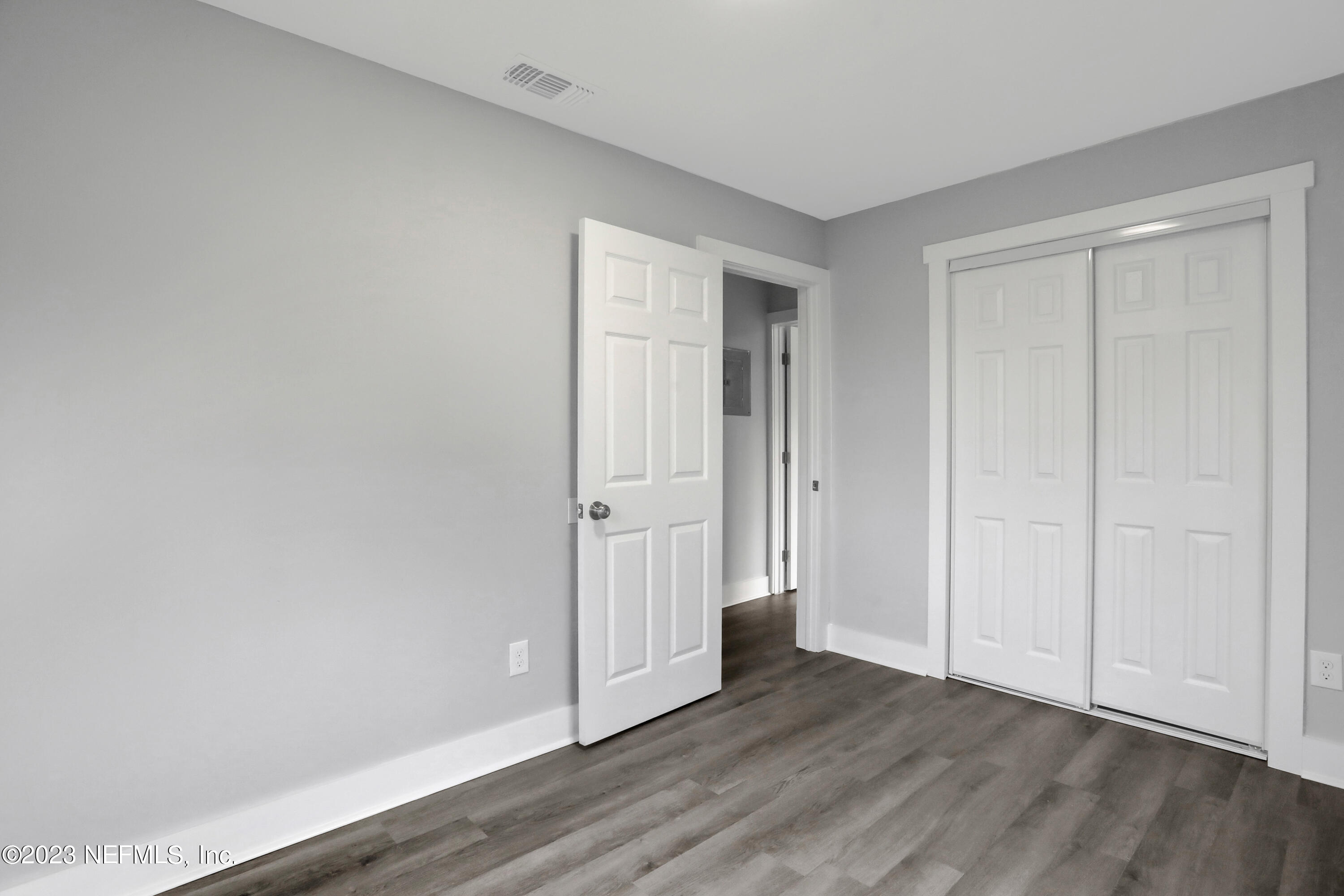 45195 Browns Farm Road Callahan, FL 32011 - Photo 20 of 24 a view of an empty room and wooden floor