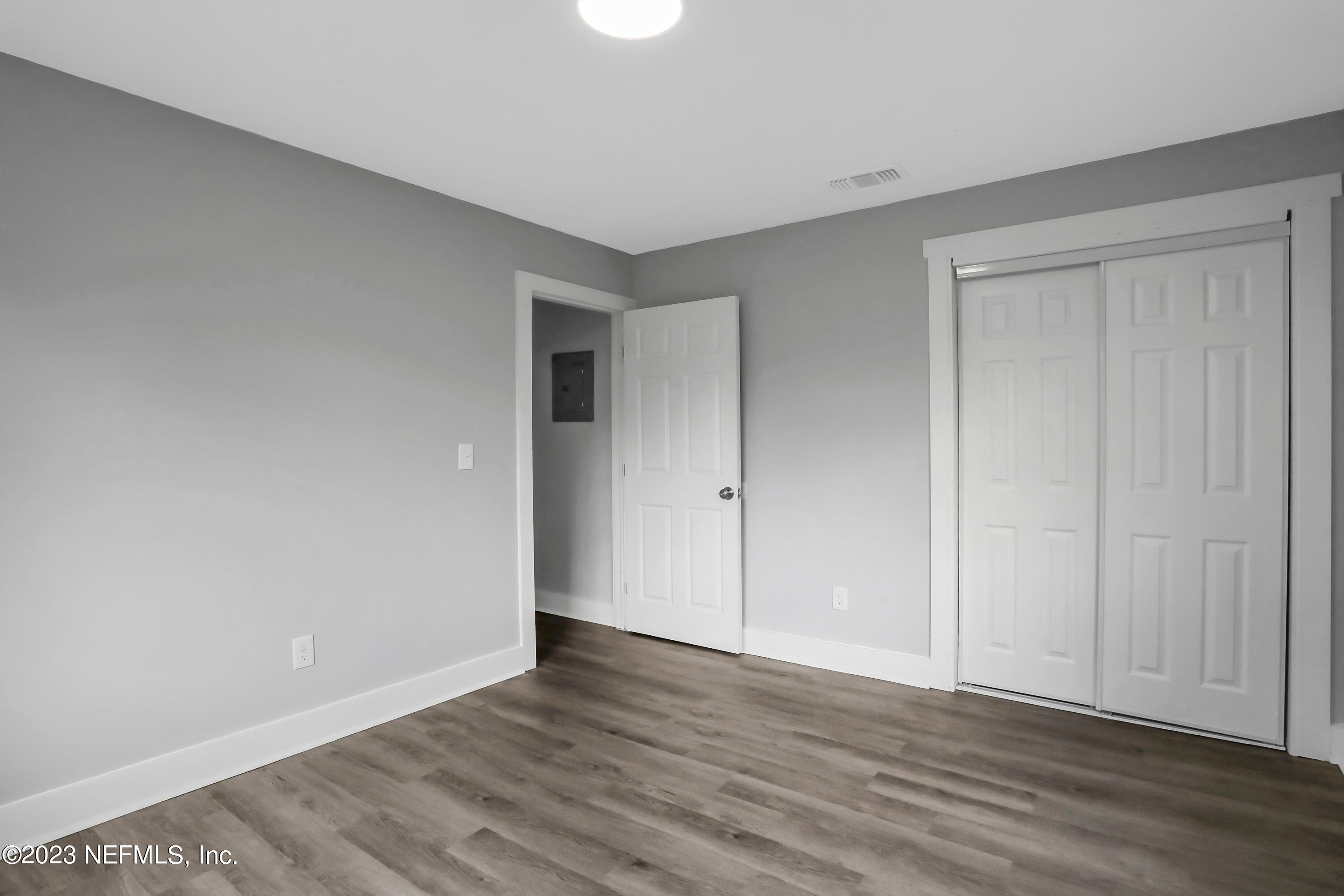 45195 Browns Farm Road Callahan, FL 32011 - Photo 21 of 24 a view of an empty room with wooden floor