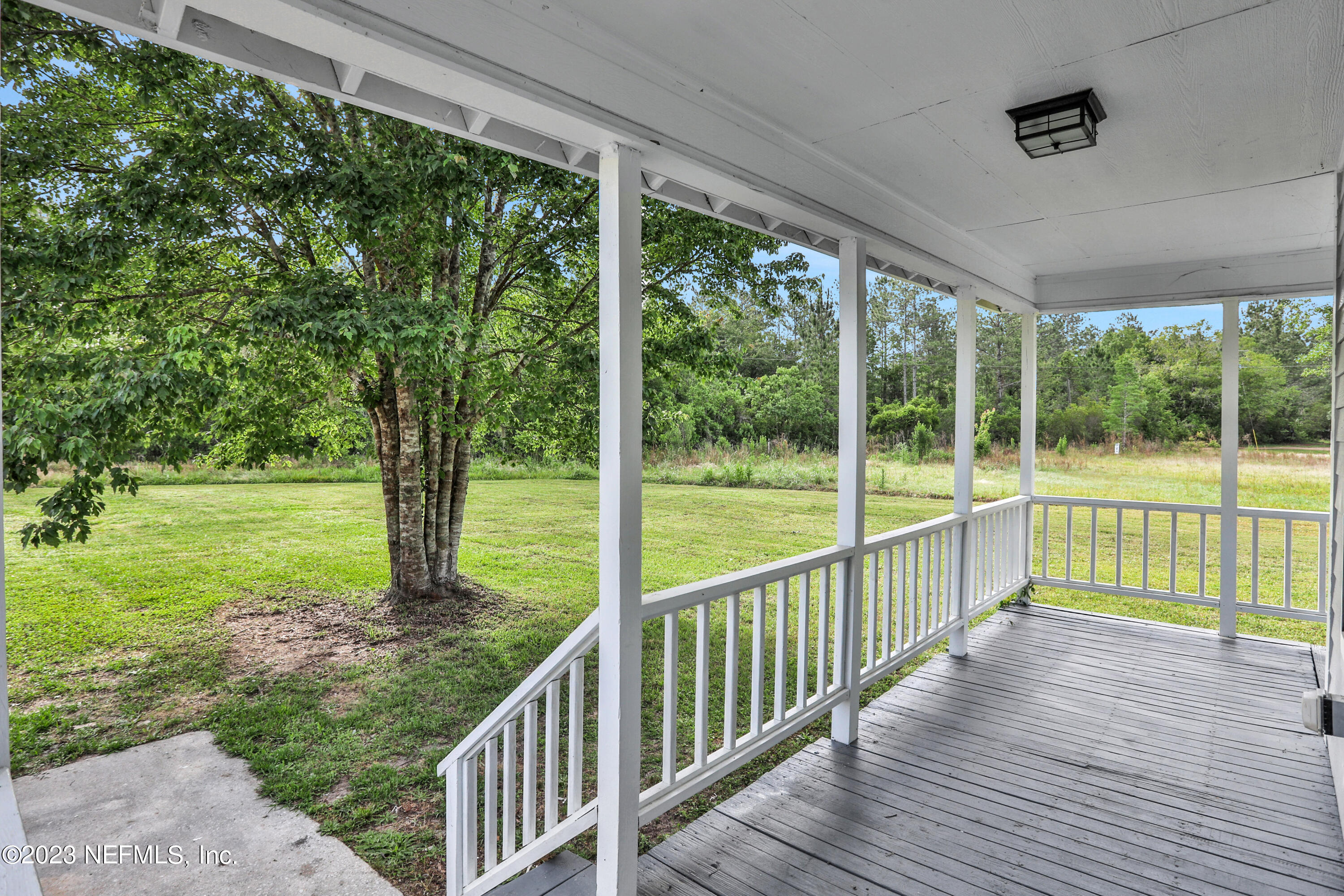 45195 Browns Farm Road Callahan, FL 32011 - Photo 23 of 24 a view of a deck with a yard