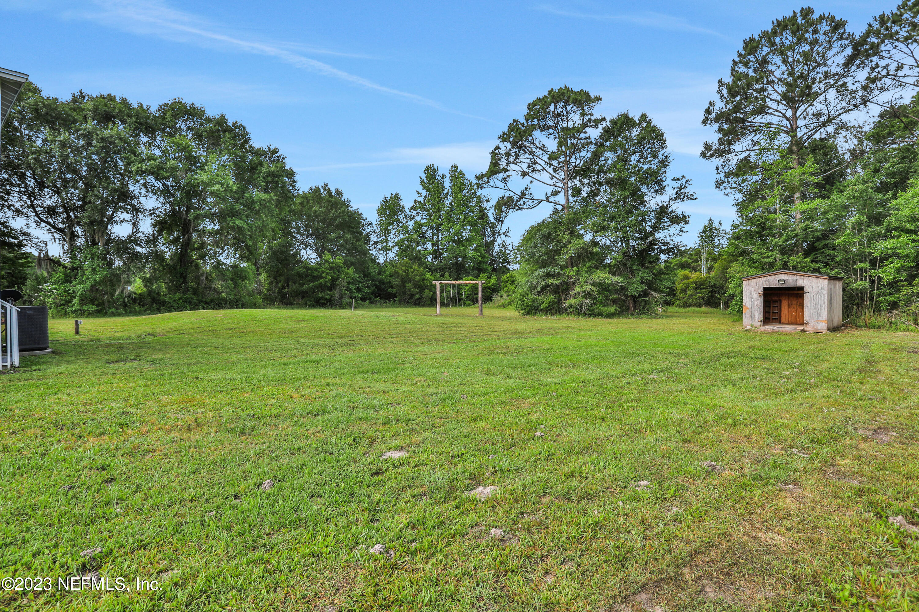 45195 Browns Farm Road Callahan, FL 32011 - Photo 24 of 24 a backyard of a house with lots of green space
