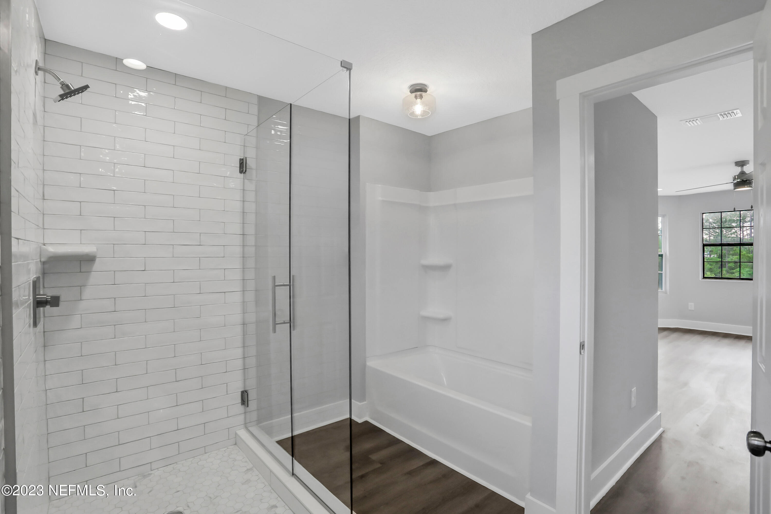 45195 Browns Farm Road Callahan, FL 32011 - Photo 5 of 24 a bathroom with a bathtub and shower