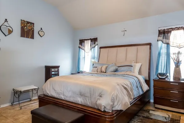 a bedroom with a bed and window