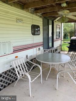 9409 Evans Road Berlin, MD 21811 - Photo 7 of 13 a outdoor dining space with furniture