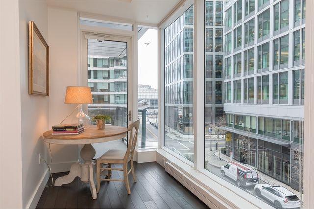 a dining room with a table and chairs