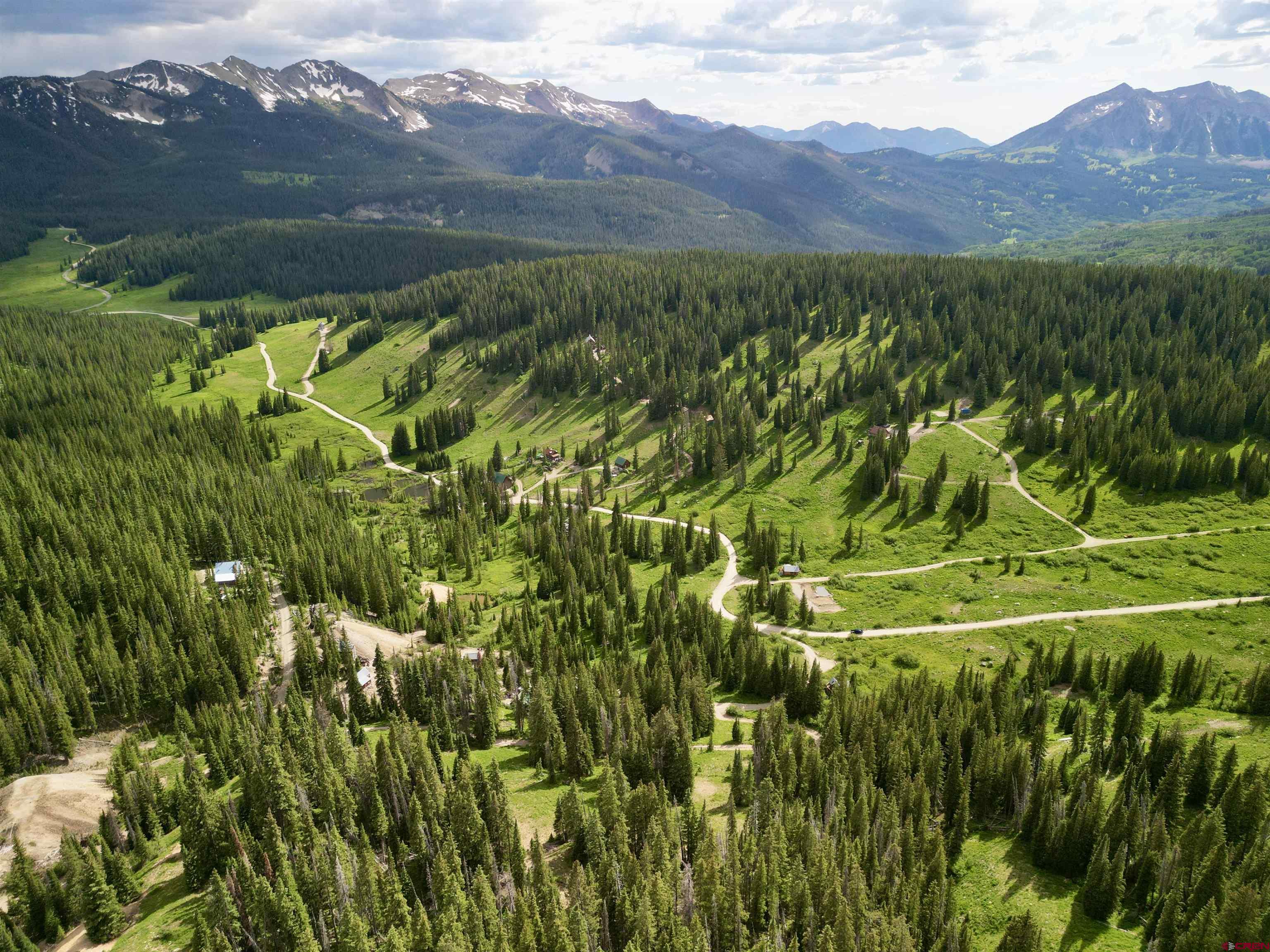 Tbd Tbd Copley Lake Road Crested Butte, CO 81224 - Photo 15 of 28 a view of a lush green hillside and a houses