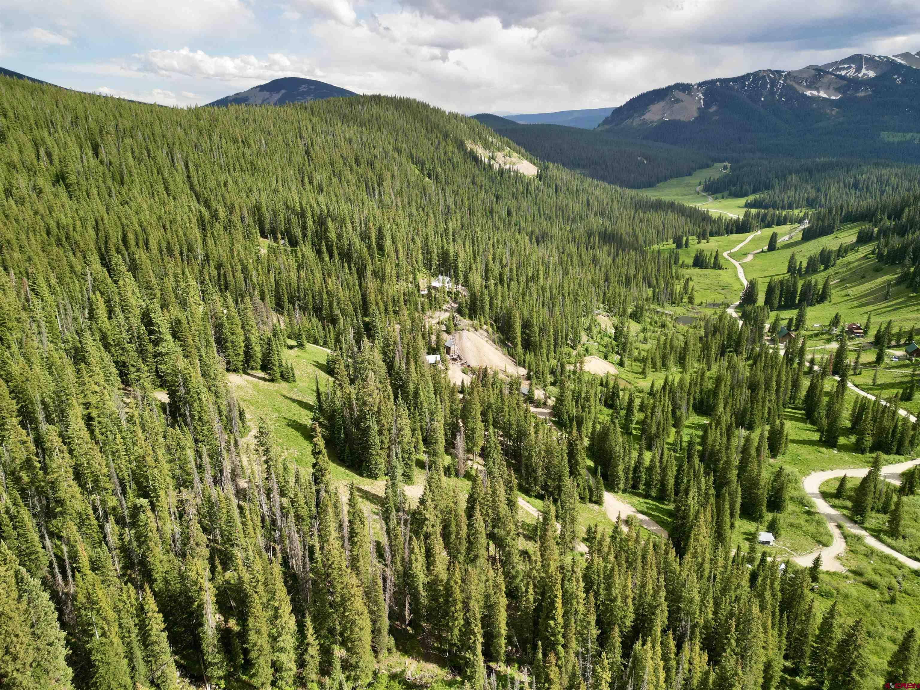 Tbd Tbd Copley Lake Road Crested Butte, CO 81224 - Photo 25 of 28 a view of a lush green hillside and a houses