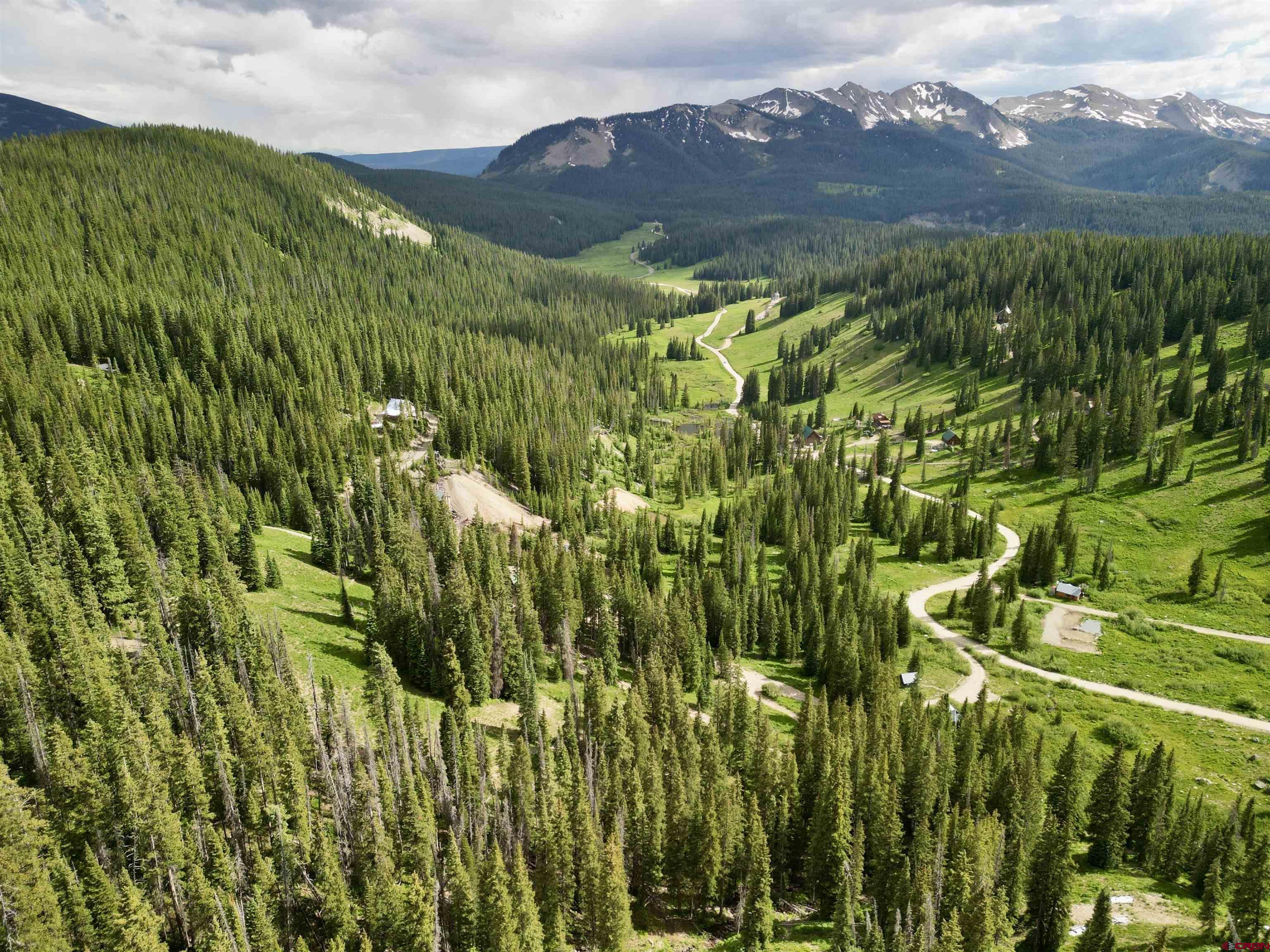 Tbd Tbd Copley Lake Road Crested Butte, CO 81224 - Photo 4 of 28 a view of a lush green hillside and a houses