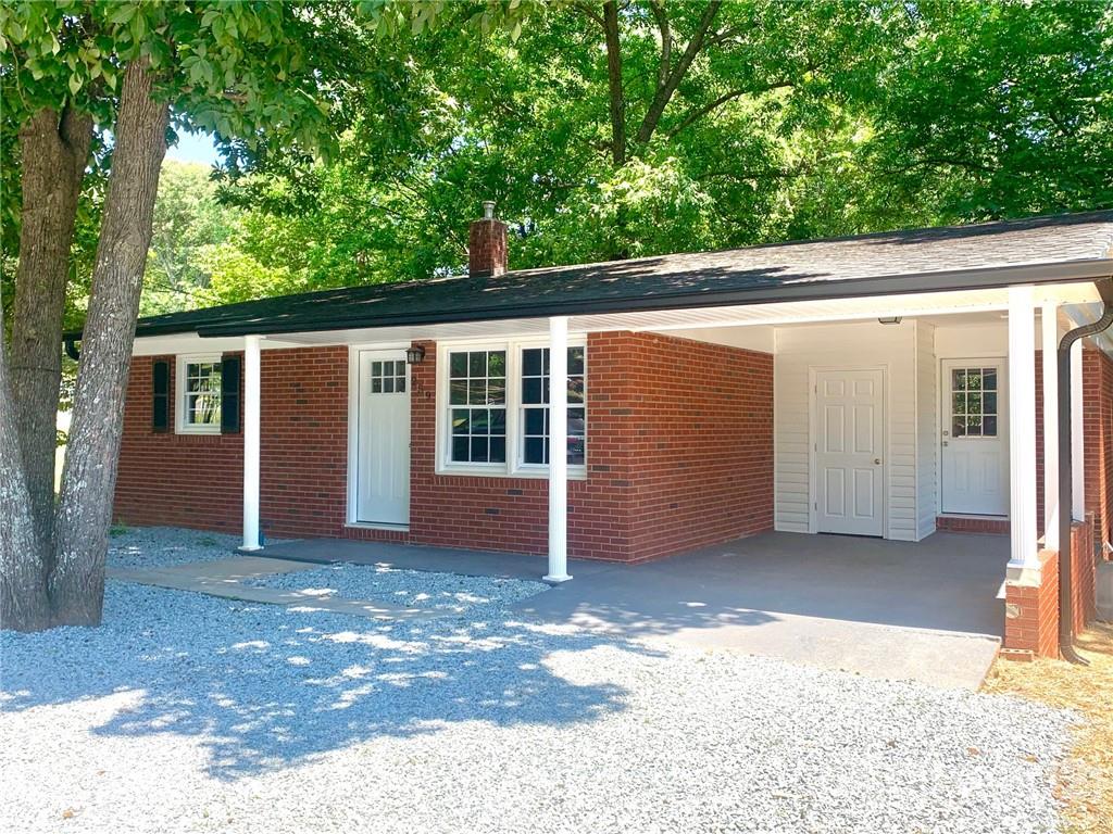 259 Roberta Road Concord, NC 28027 - Photo 1 of 12 a view of a house with a backyard