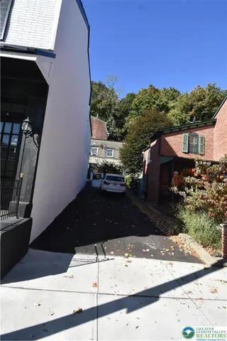 a view of a yard from a balcony