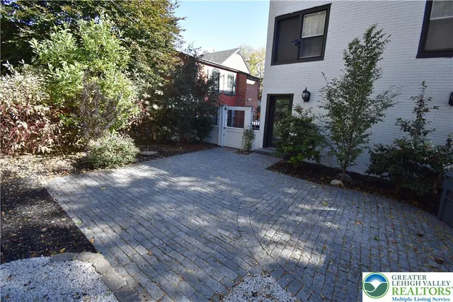 a view of a house with a yard and plants