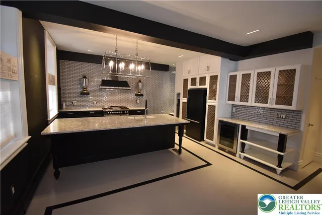 a view of living room with furniture and a ceiling fan