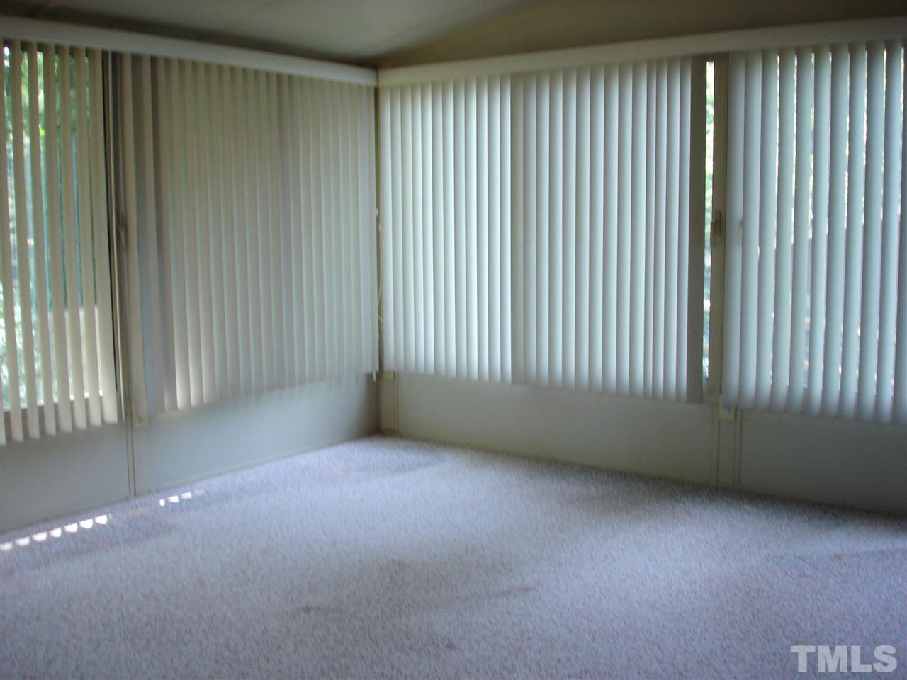4516 Oak Park Road Raleigh, NC 27612 - Photo 11 of 17 an empty room with windows