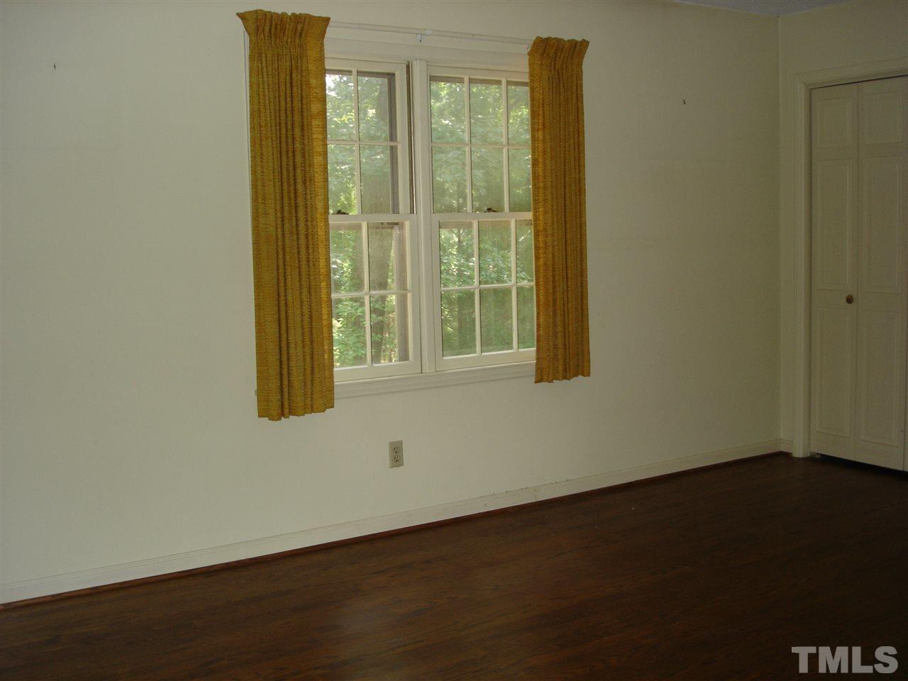 4516 Oak Park Road Raleigh, NC 27612 - Photo 16 of 17 an empty room with windows
