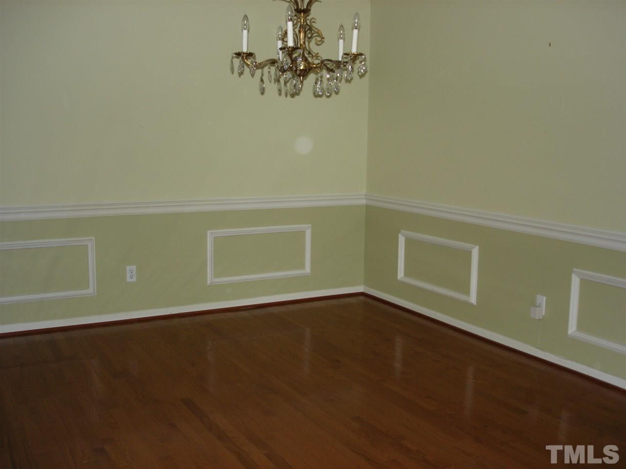 4516 Oak Park Road Raleigh, NC 27612 - Photo 3 of 17 a view of a room with wooden floor and a window