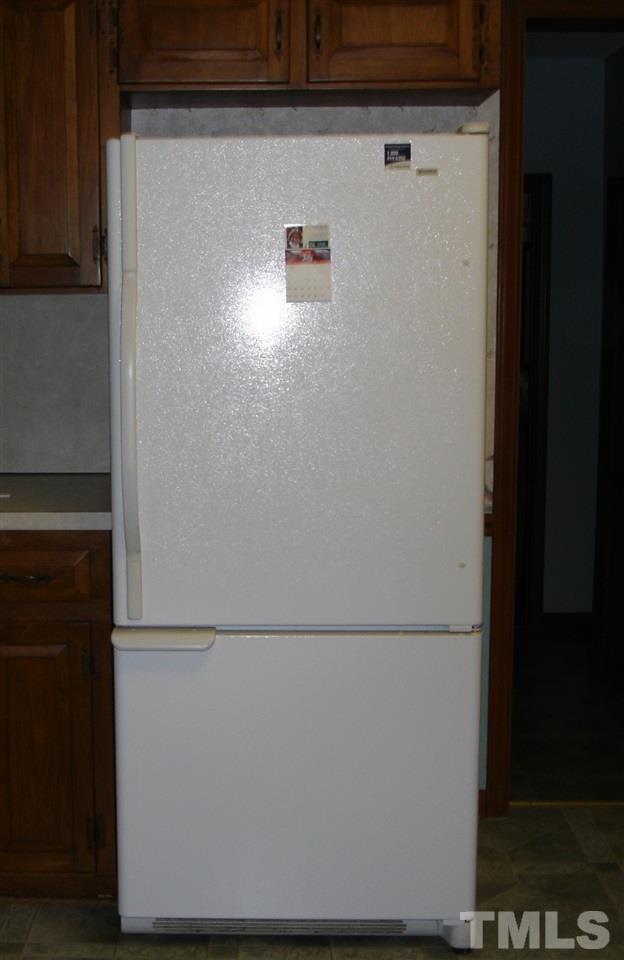 4516 Oak Park Road Raleigh, NC 27612 - Photo 9 of 17 a close view of a refrigerator in kitchen