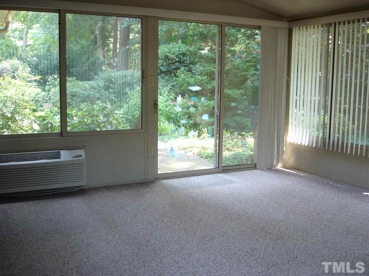 4516 Oak Park Road Raleigh, NC 27612 - Photo 10 of 17 a view of a room with large windows