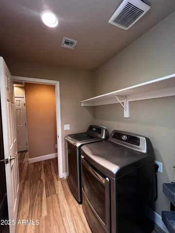 a utility room with washer and dryer