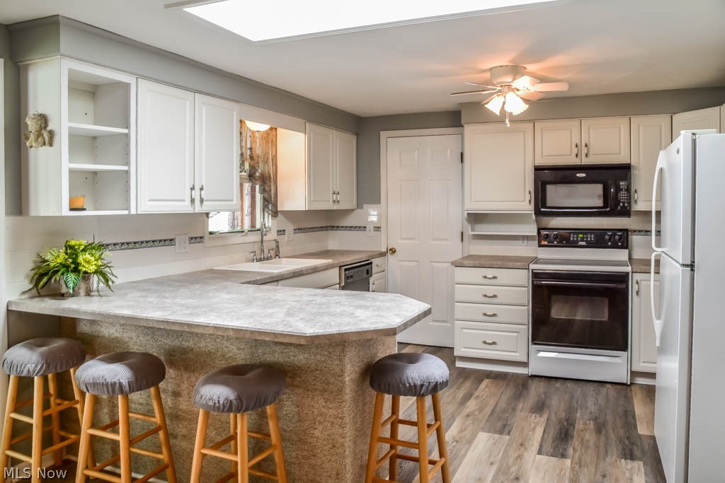 4877 4th Street Northwest Canton, OH 44708 - Photo 4 of 24 Updated, applianced kitchen with a breakfast bar, new countertops and sink.