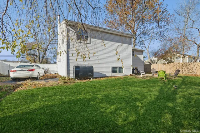 a couple of cars parked in front of a house
