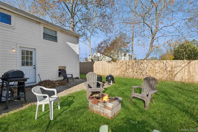 a backyard of a house with seating space