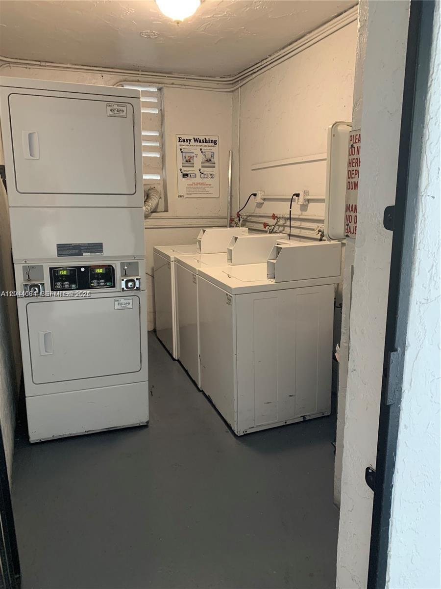 2460 Southwest 18th Avenue, Unit 1205 Miami, FL 33133 - Photo 21 of 21 a utility room with dryer and washer
