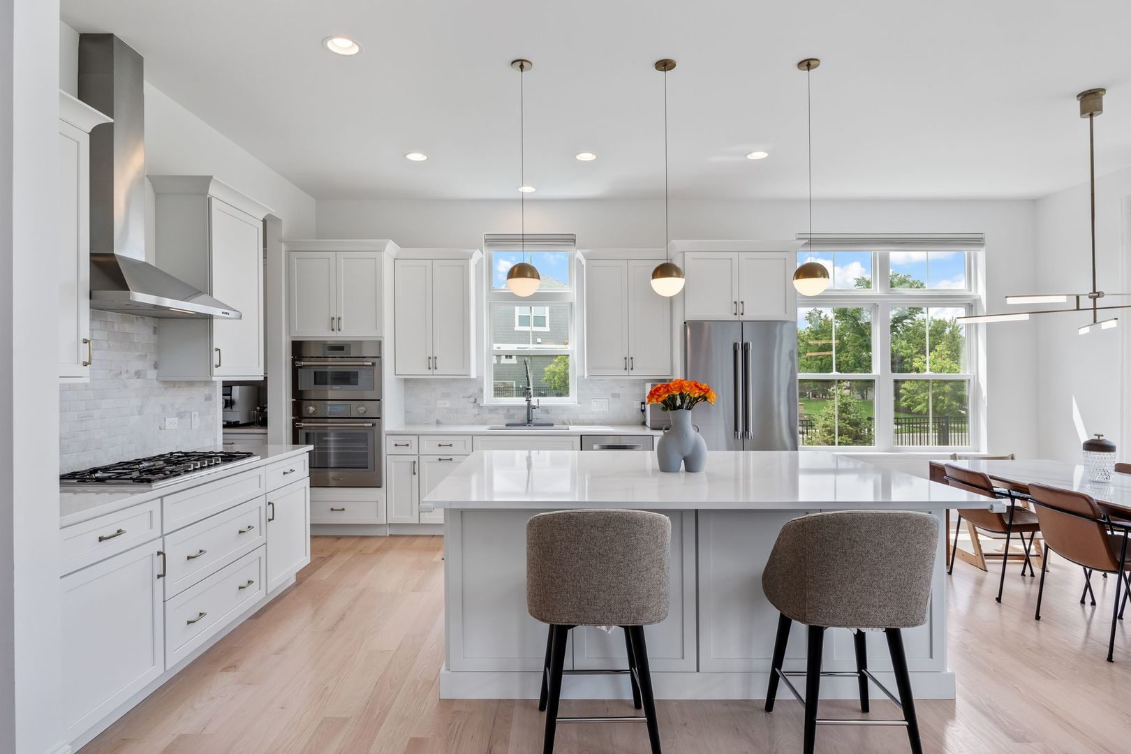 2834 Parkside Circle Glenview, IL 60026 - Photo 12 of 59 a kitchen with stainless steel appliances kitchen island granite countertop a stove a refrigerator and a view of living room