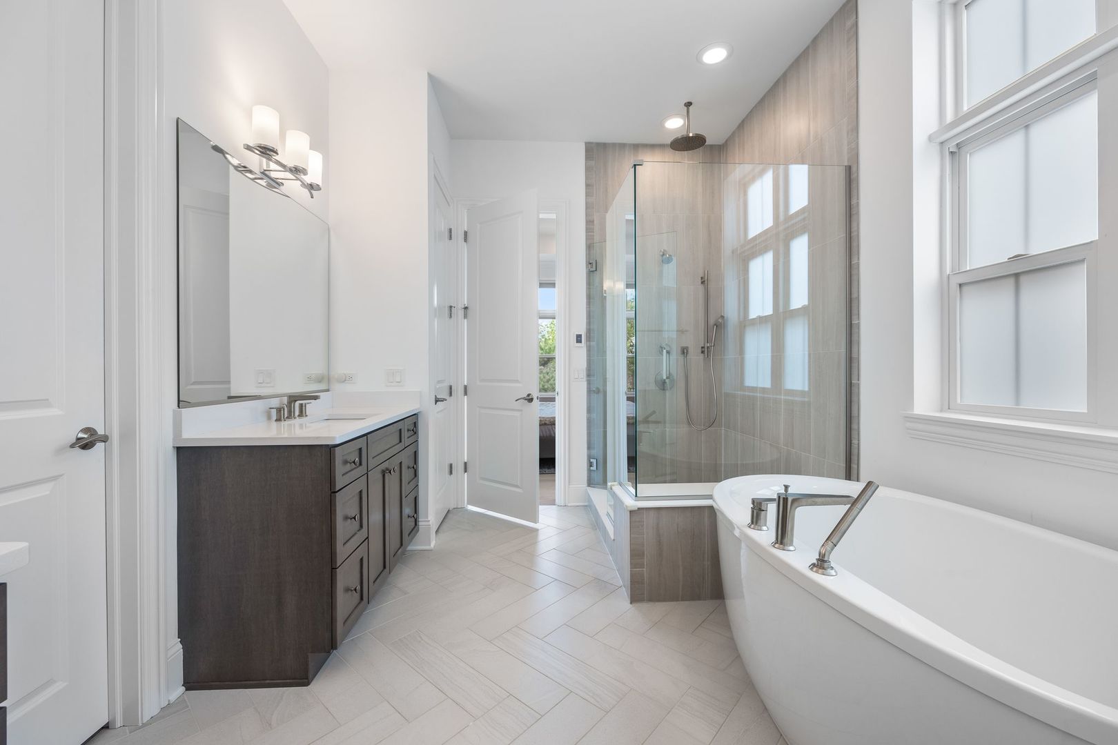 2834 Parkside Circle Glenview, IL 60026 - Photo 29 of 59 a bathroom with a double vanity sink a mirror a bathtub and shower