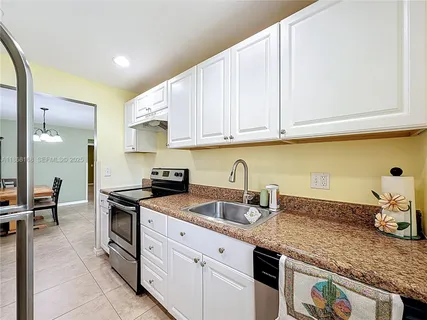 a view of a hallway with wooden shelves