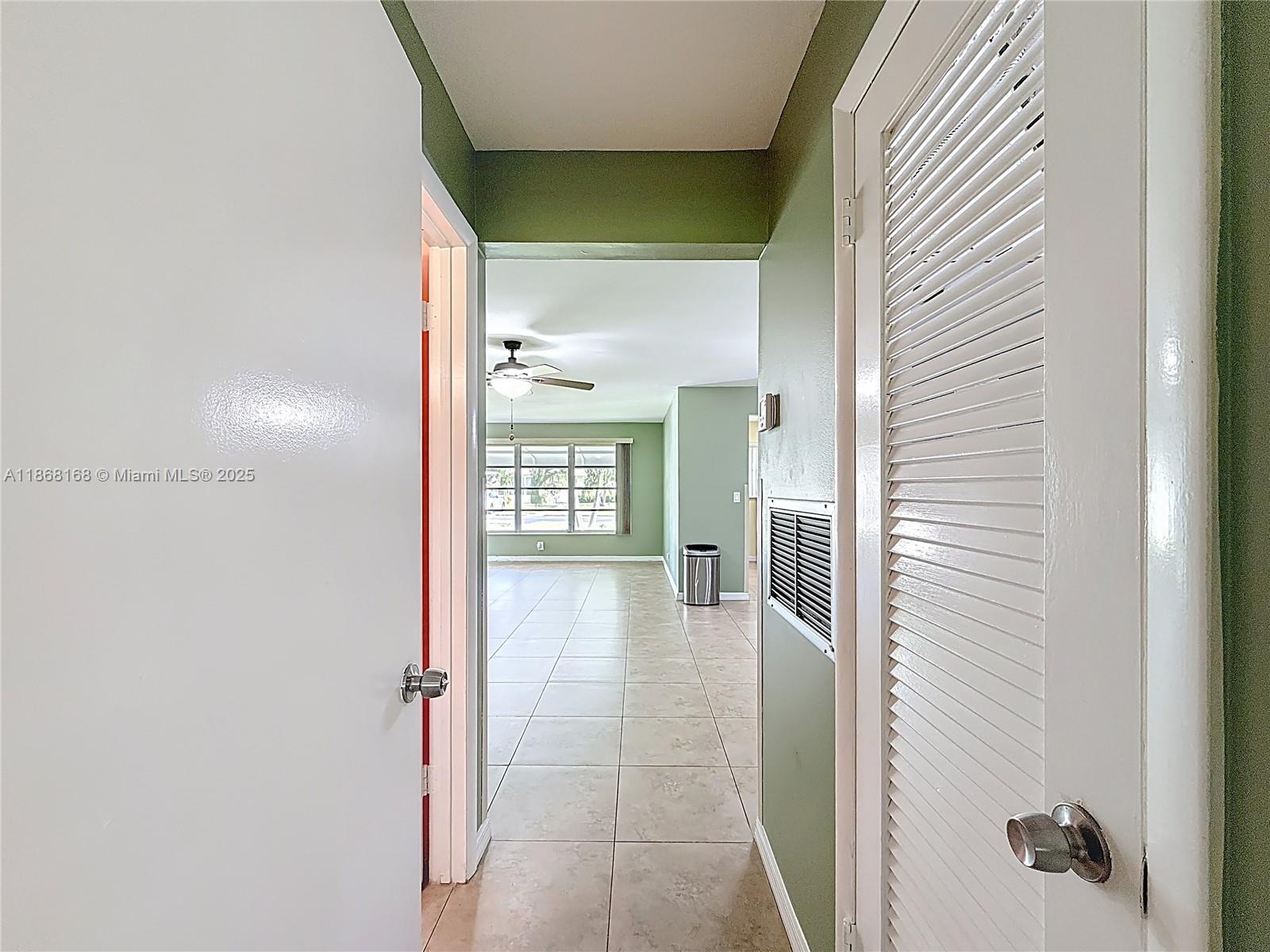 290 Main Boulevard, Unit C Boynton Beach, FL 33435 - Photo 23 of 56 a view of a hallway with wooden shelves
