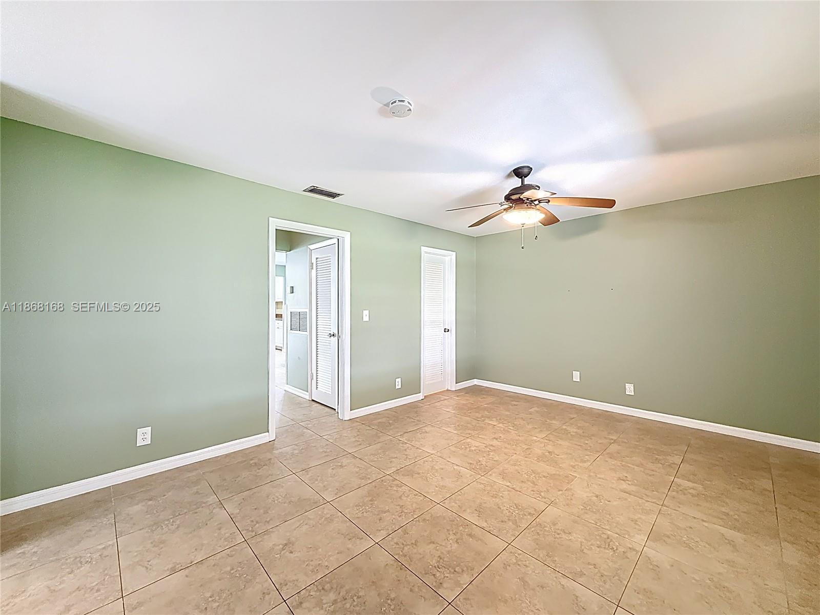 290 Main Boulevard, Unit C Boynton Beach, FL 33435 - Photo 26 of 56 a view of a livingroom and a chandelier fan
