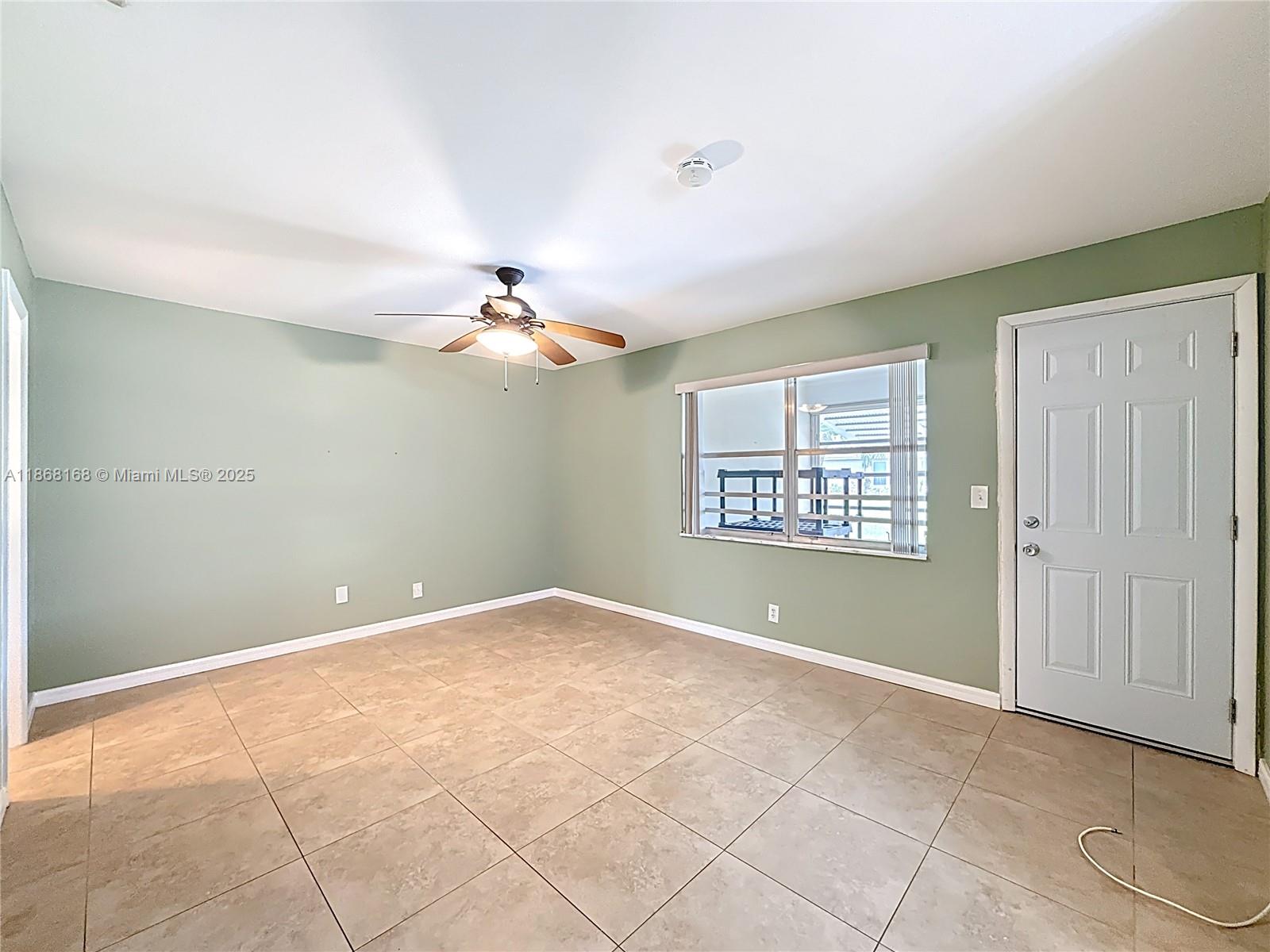 290 Main Boulevard, Unit C Boynton Beach, FL 33435 - Photo 27 of 56 a view of an empty room with a window