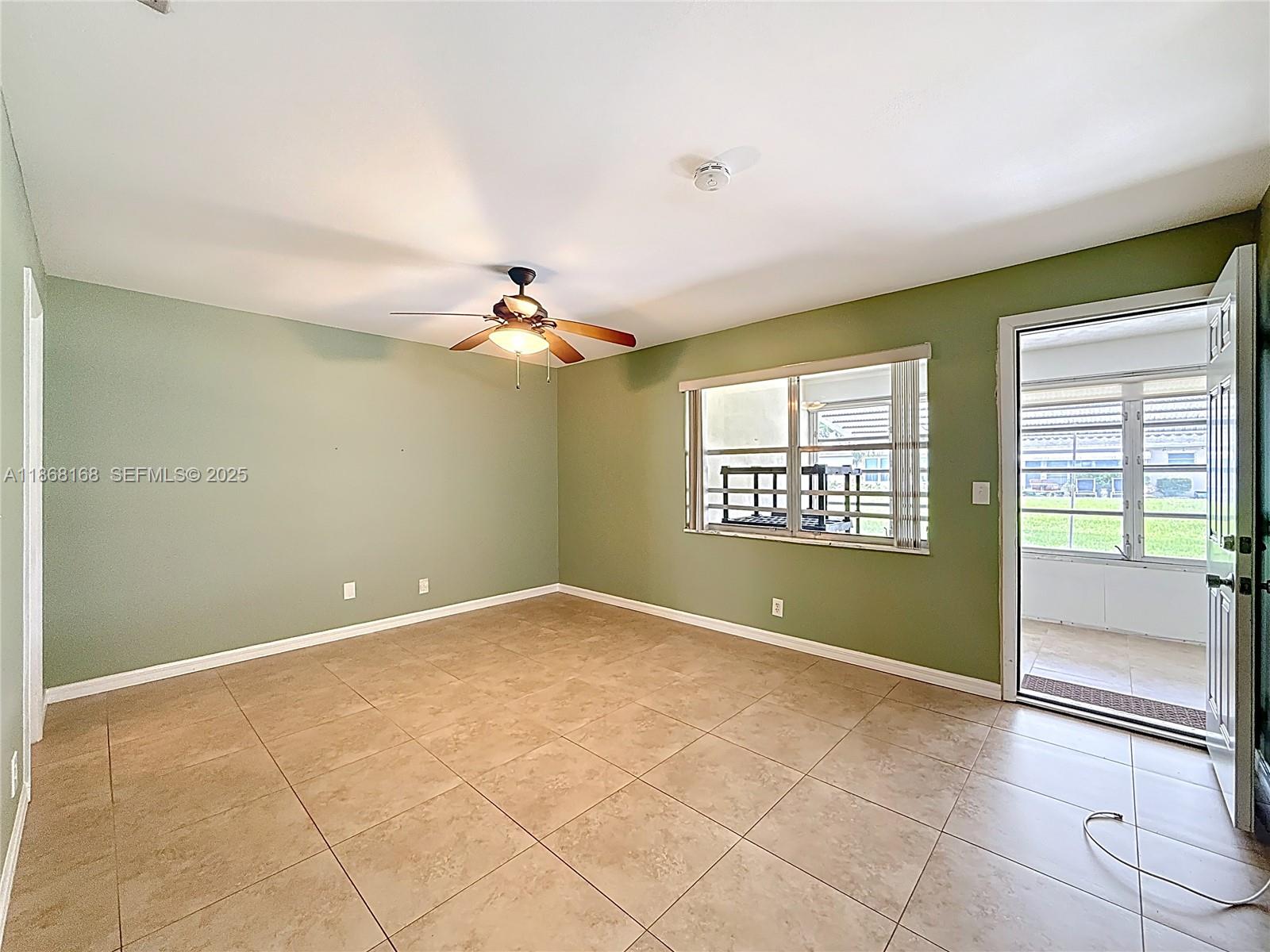 290 Main Boulevard, Unit C Boynton Beach, FL 33435 - Photo 28 of 56 a view of an empty room with a window