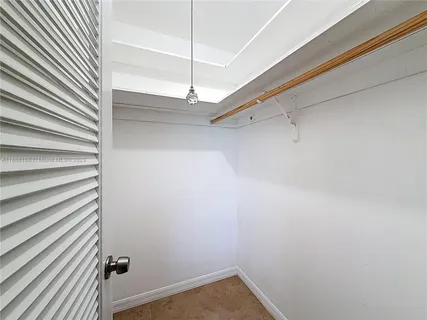 a bathroom with a shower sink vanity and mirror