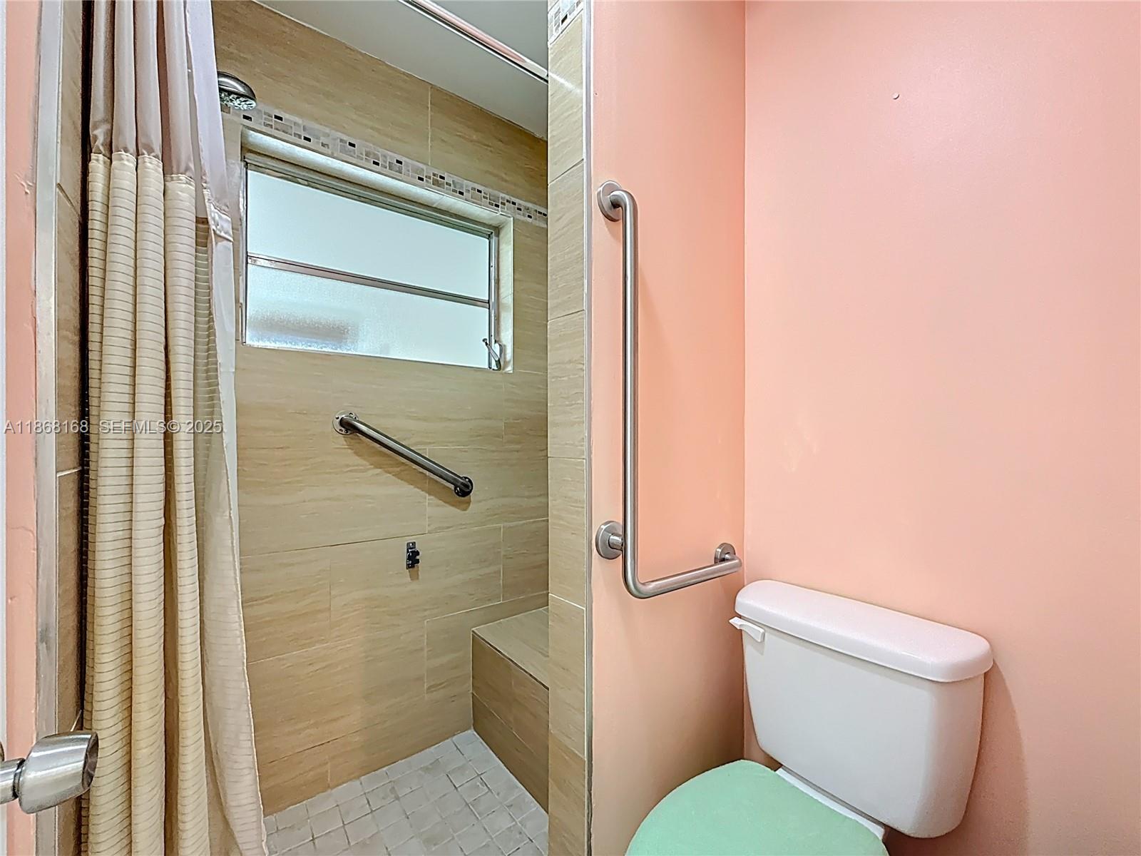 290 Main Boulevard, Unit C Boynton Beach, FL 33435 - Photo 33 of 56 a white toilet sitting next to a bathroom sink