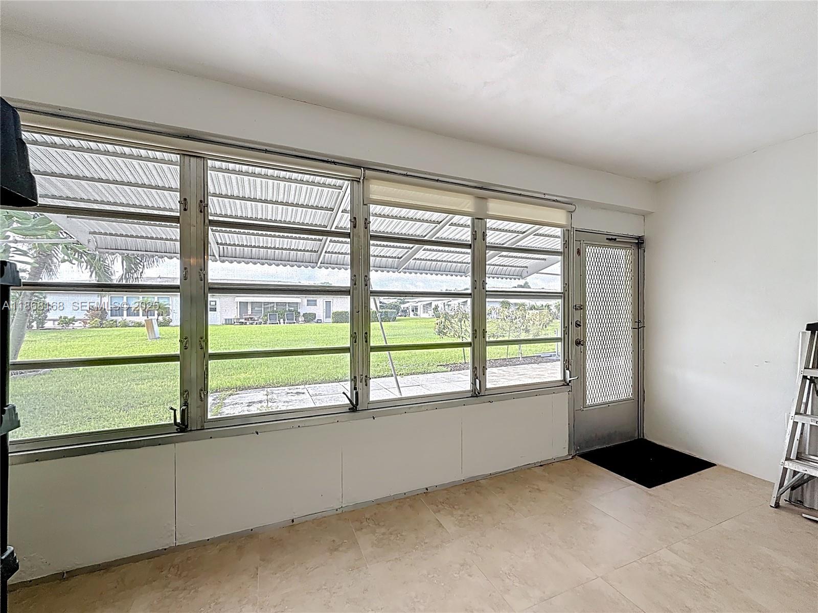 290 Main Boulevard, Unit C Boynton Beach, FL 33435 - Photo 36 of 56 a view of an empty room with a window