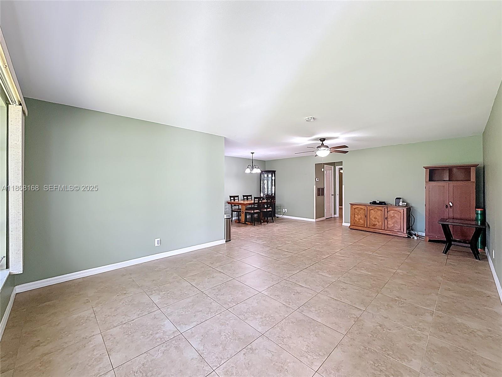 290 Main Boulevard, Unit C Boynton Beach, FL 33435 - Photo 4 of 56 a view of a livingroom with furniture and a ceiling fan