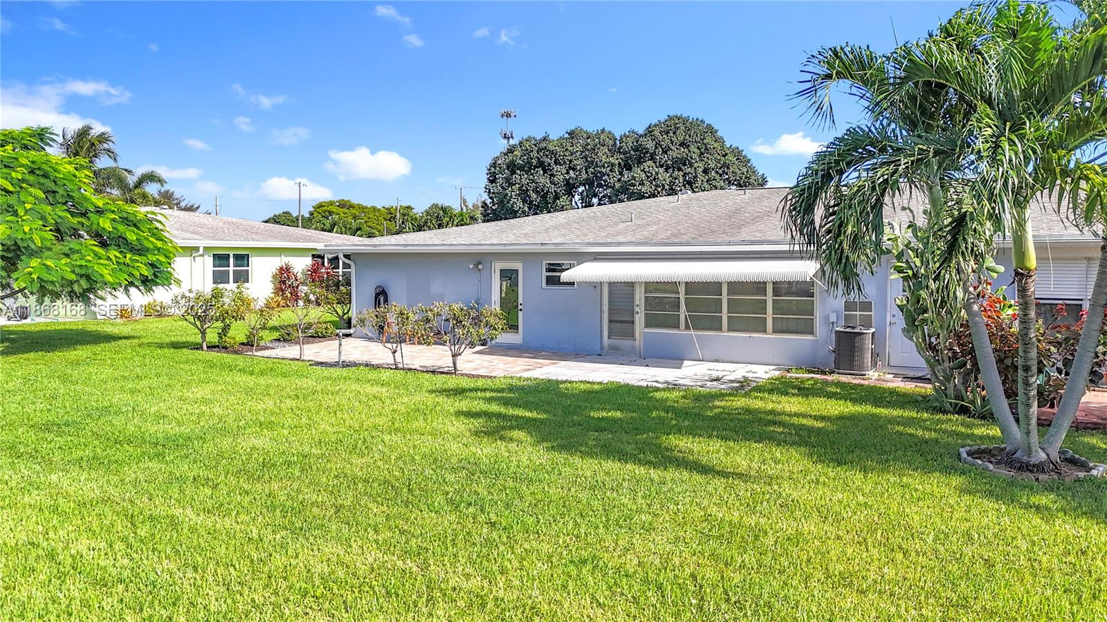 290 Main Boulevard, Unit C Boynton Beach, FL 33435 - Photo 46 of 56 a front view of house with yard and green space