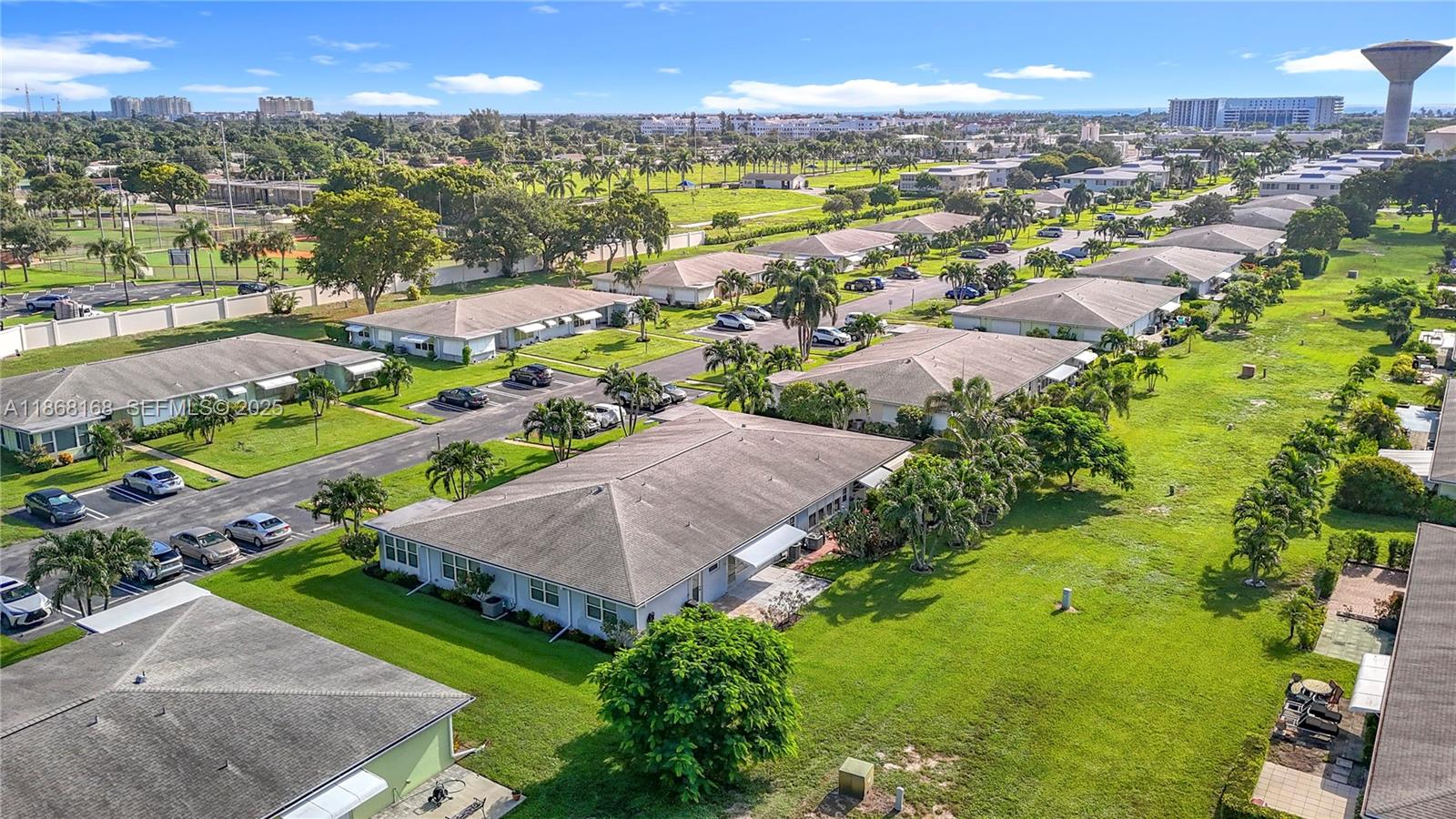 290 Main Boulevard, Unit C Boynton Beach, FL 33435 - Photo 52 of 56 an aerial view of residential houses with outdoor space and trees
