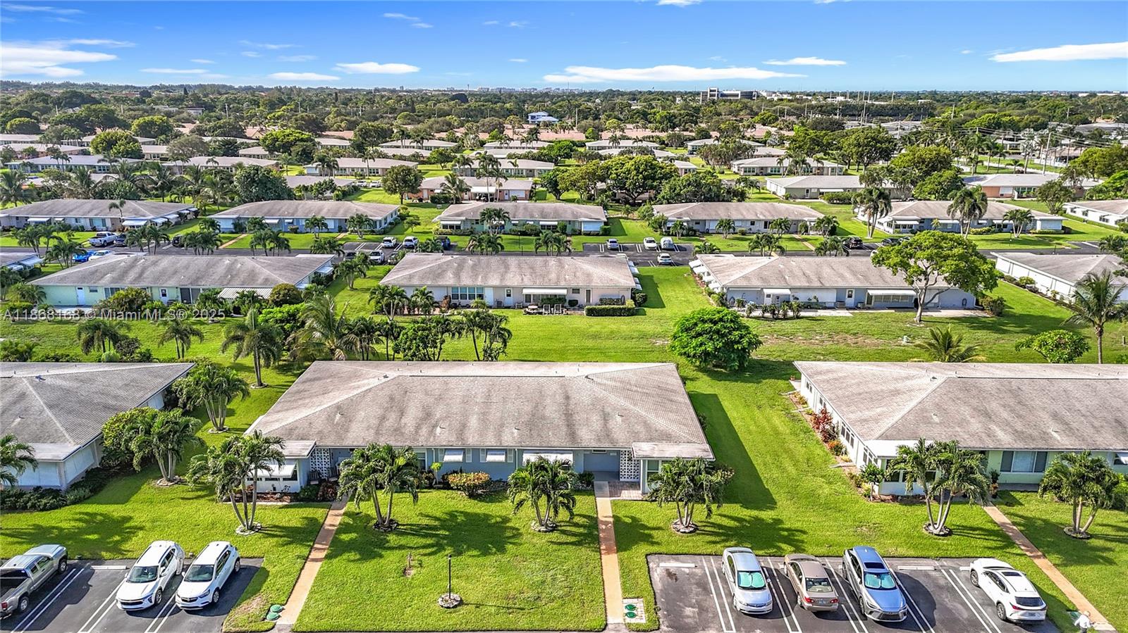 290 Main Boulevard, Unit C Boynton Beach, FL 33435 - Photo 56 of 56 an aerial view of a house with a swimming pool outdoor seating and yard