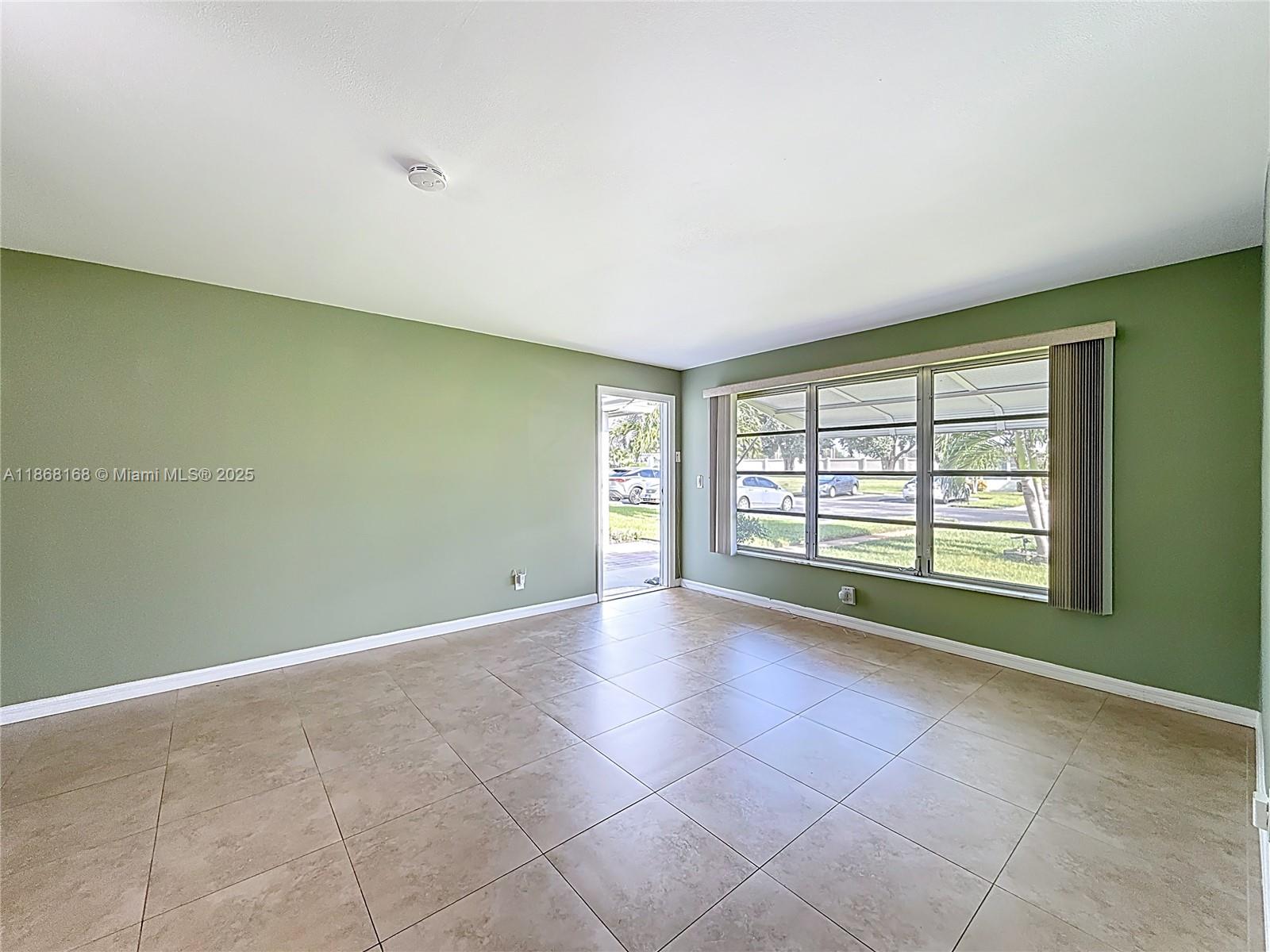 290 Main Boulevard, Unit C Boynton Beach, FL 33435 - Photo 7 of 56 a view of an empty room with a window