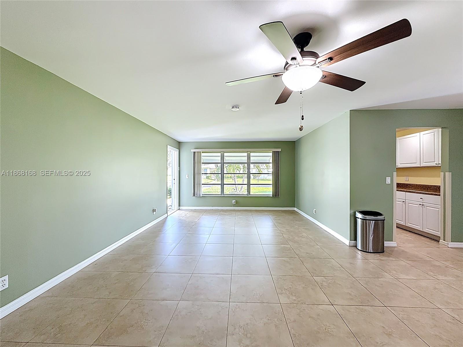 290 Main Boulevard, Unit C Boynton Beach, FL 33435 - Photo 8 of 56 a view of an empty room with a window