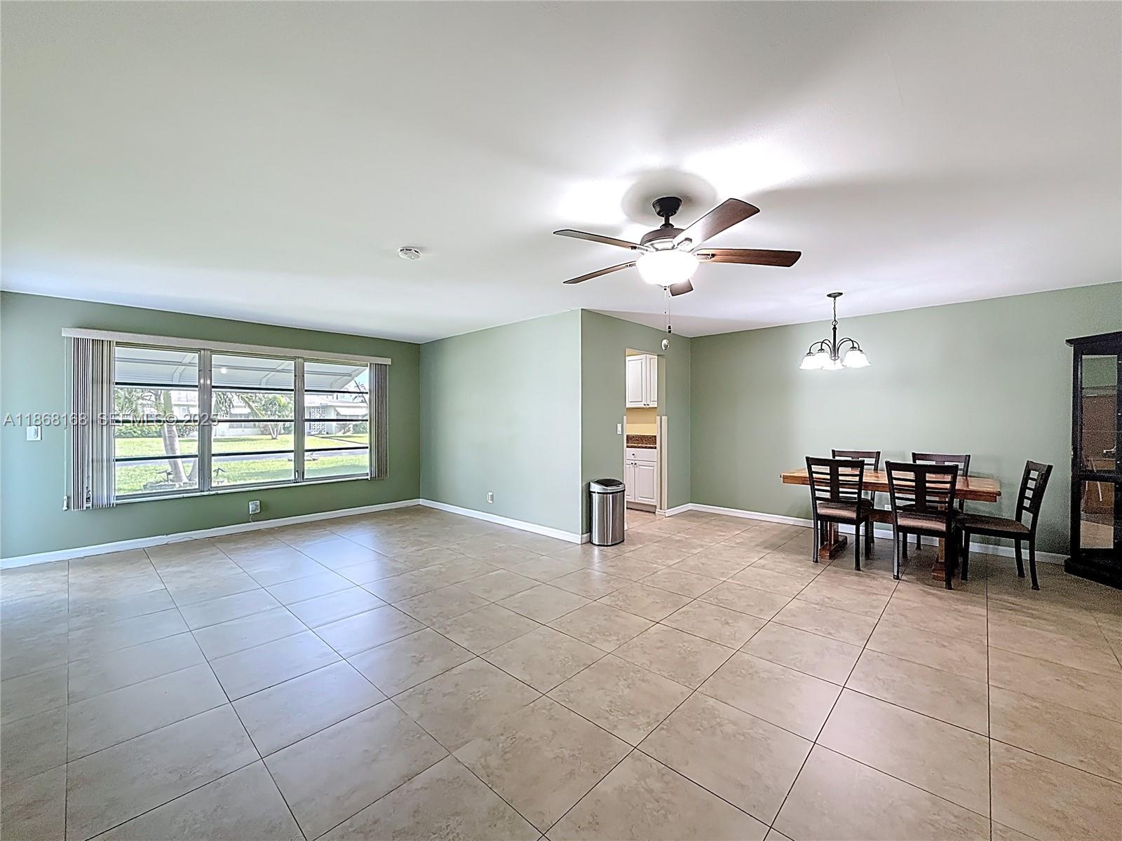 290 Main Boulevard, Unit C Boynton Beach, FL 33435 - Photo 9 of 56 a view of a livingroom with furniture and a ceiling fan