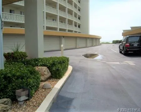 a view of a car parked in front of a building