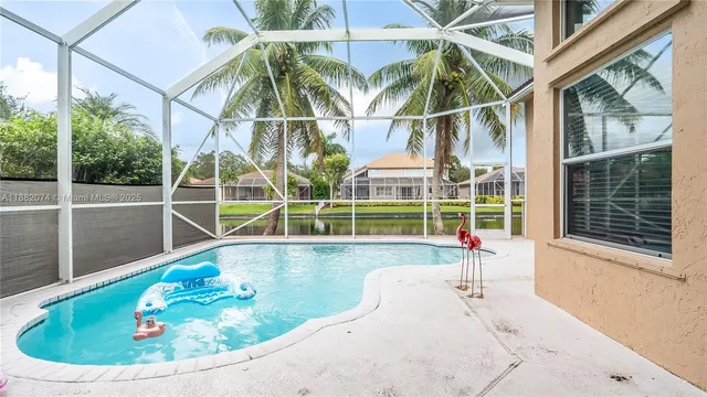a view of a swimming pool with a lounge chairs
