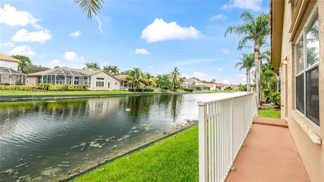 a view of a lake with a house in the background