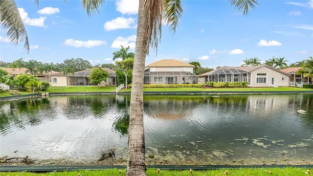 a view of a lake with a house in the background