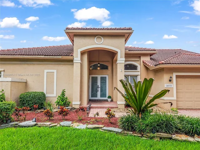 a front view of a house with garden